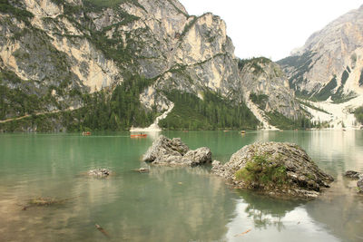Scenic view of lake and mountains against sky