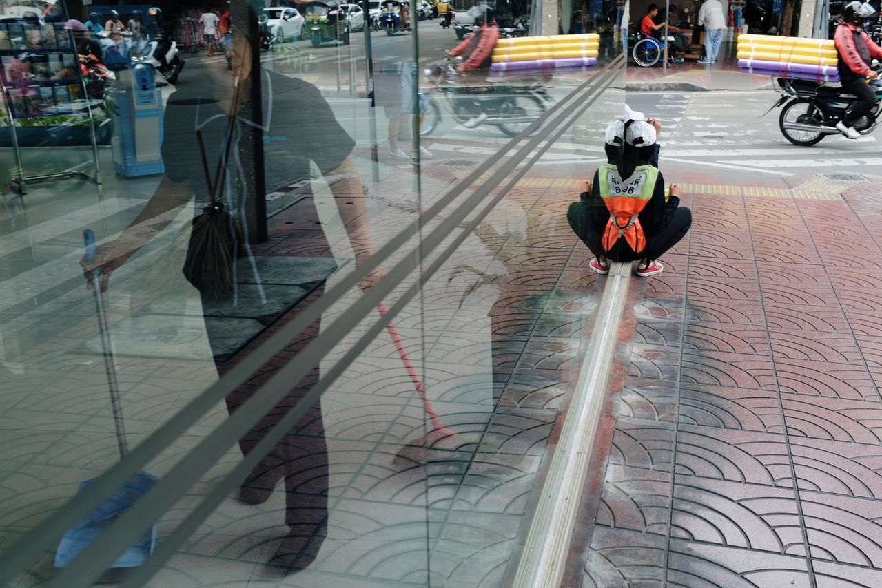 HIGH ANGLE VIEW OF PEOPLE WALKING ON STREET