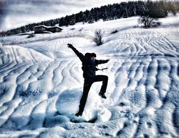 Full length of senior woman in snow