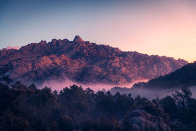 Scenic view of mountains against sky during sunset