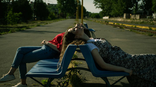 Woman lying on chair