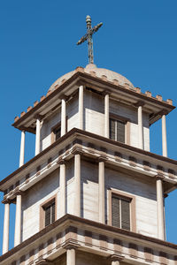 Low angle view of building against clear blue sky