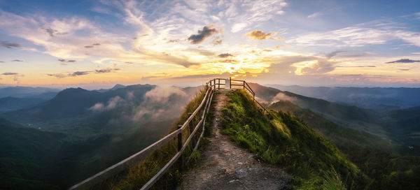 Panoramic view of footpath along mountains