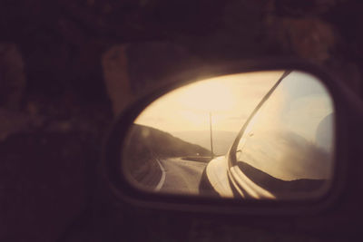 Reflection of car on side-view mirror