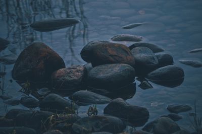 Close-up of stones in sea