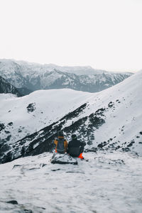 Scenic view of snowcapped mountains against clear sky