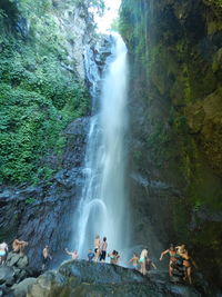 Scenic view of waterfall against sky