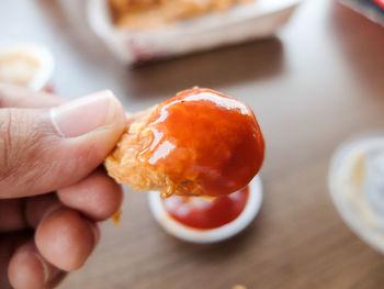 Close-up of hand holding ice cream