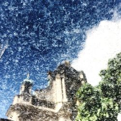 Digital composite image of building and trees against sky