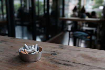 Close-up of cigarette on table