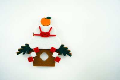 Close-up of christmas decoration against white background