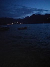 Scenic view of sea against sky at night