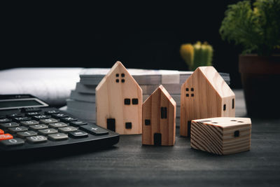 Close-up of toy on table against building