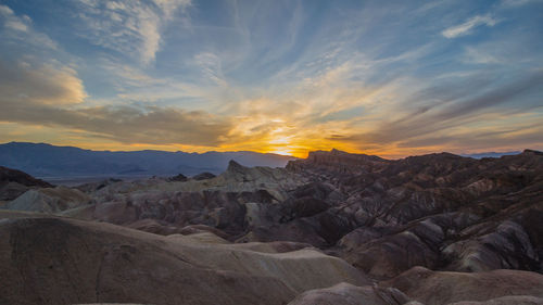 Scenic view of landscape against sky during sunset