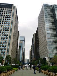 Low angle view of modern buildings in city against sky