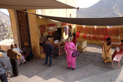 Rear view of people walking in temple