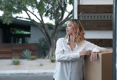 Woman standing in front of building