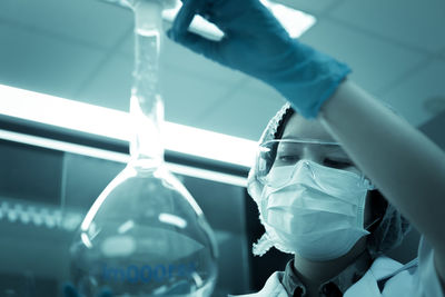 Scientist examining chemical in laboratory