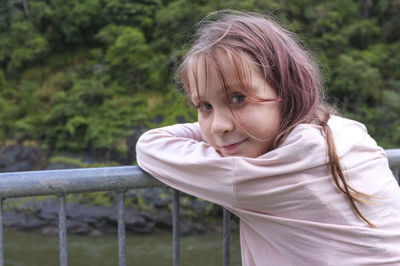 Close-up portrait of happy girl in park