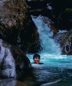 Portrait of man swimming in water