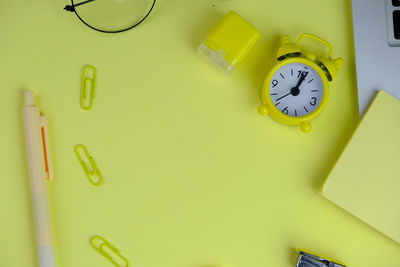 Directly above shot of clock on table