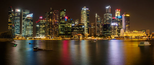 Illuminated city at waterfront