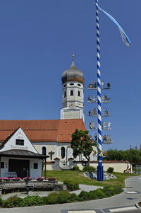 Temple against clear blue sky