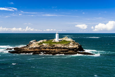Scenic view of sea against blue sky
