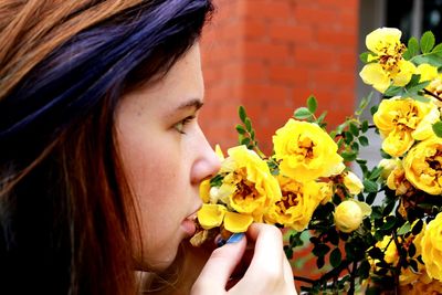 Close-up of woman holding roses