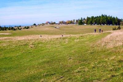 People on field against sky