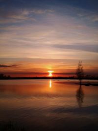 View of calm sea at sunset