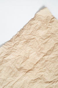 Low angle view of paper against white background