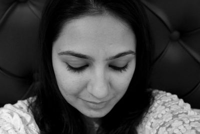 Close-up portrait of beautiful woman at home