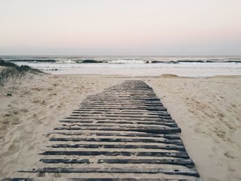 Scenic view of beach against clear sky