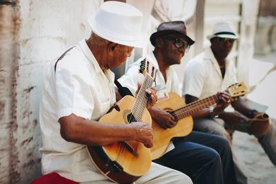Man playing guitar at music concert