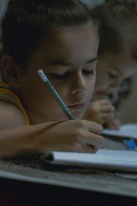 Close-up of girl drawing on mirror