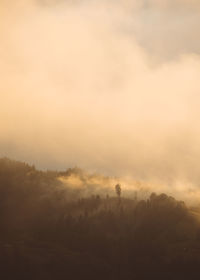 Scenic view of silhouette landscape against sky at sunset