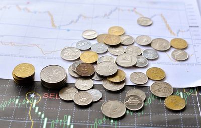 High angle view of coins on table