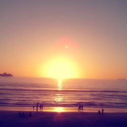 Scenic view of sea against clear sky during sunset