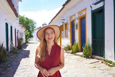 Beautiful elegant girl visiting brazil. holidays in the colonial historic town of paraty