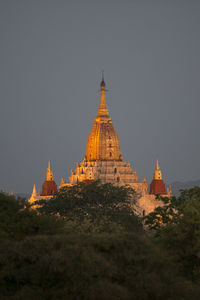 Illuminated historic temple against sky at dusk