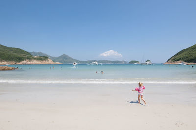 Scenic view of beach against clear sky