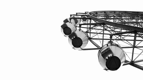 Low angle view of ferris wheel against clear sky