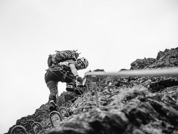Woman standing against clear sky