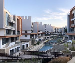 Modern buildings in city against sky