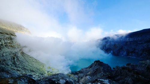 Scenic view of volcanic mountains against sky