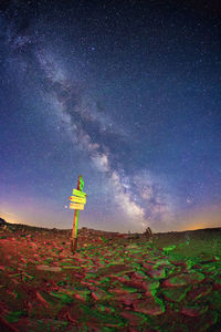 Scenic view of field against sky at night