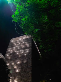 Low angle view of illuminated building at night