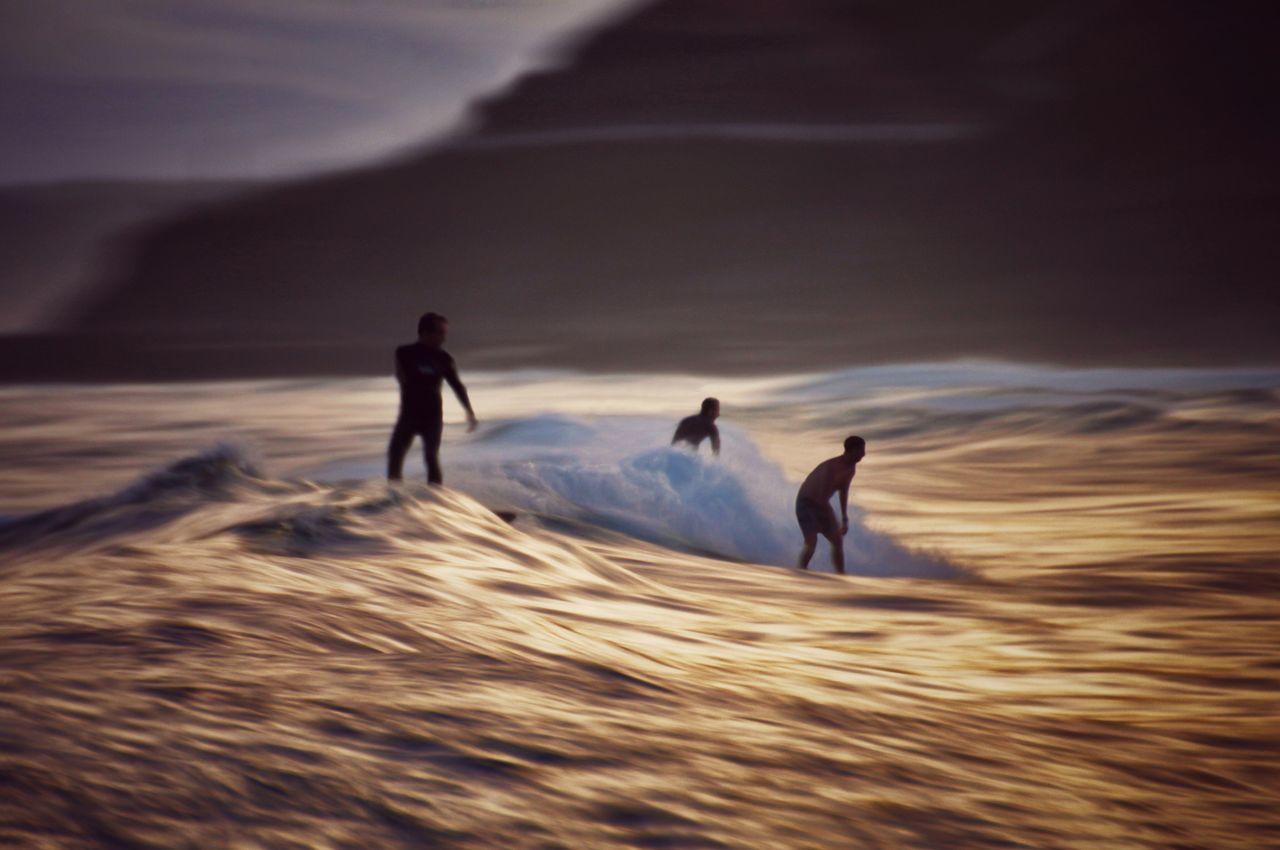 Surfing surfers wave silhouette seascape long exposure sunset beach ocean downtime saltwater-fix