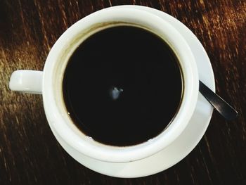 Directly above shot of coffee cup on table